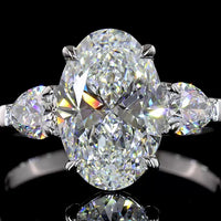 14K White Gold Three-Stone Ring with 2.69 Carat Oval Cut Lab Diamond and 0.66 Carat Pear Shaped Side Stones - IGI Certified E VVS2 - Covaloro Fine Jewelry
