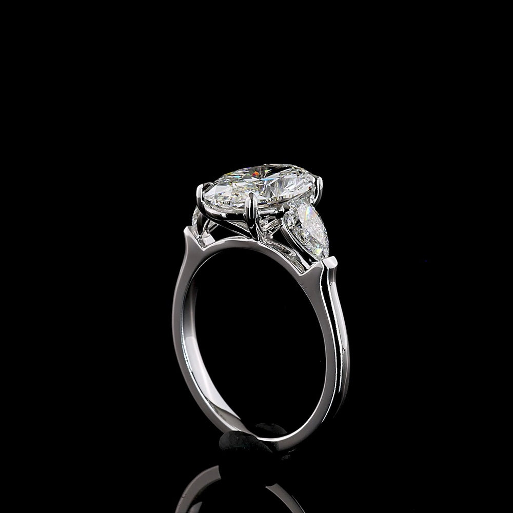 14K White Gold Three-Stone Ring with 2.69 Carat Oval Cut Lab Diamond and 0.66 Carat Pear Shaped Side Stones - IGI Certified E VVS2 - Covaloro Fine Jewelry