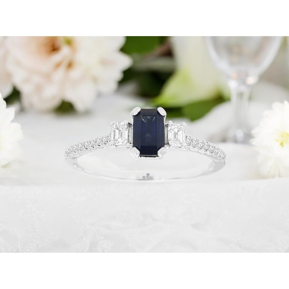 14K White Gold Three-Stone Ring with Emerald-Cut Sapphire and Diamond Accents - 0.70 Carat Center Sapphire and 0.28 Carat Total Diamond Weight - Royal Jewelry