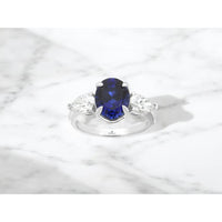 14K White Gold Three-Stone Ring with Oval Lab-Grown Sapphire and Pear Lab-Grown Diamond Side Stones - 3.8 Carat Sapphire and 1 Carat Total Diamond Weight - Royal Jewelry