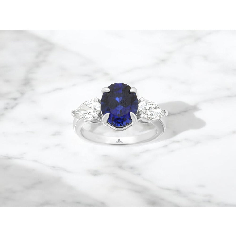 14K White Gold Three-Stone Ring with Oval Lab-Grown Sapphire and Pear Lab-Grown Diamond Side Stones - 3.8 Carat Sapphire and 1 Carat Total Diamond Weight - Royal Jewelry