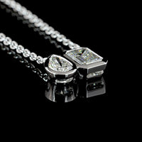 14K White Gold Toi et Moi Pendant with 1.10 Carat Emerald Cut and 0.48 Carat Pear Shape Lab Diamonds - 1.58 Carat Total Weight in Bezel Setting - Covaloro Fine Jewelry