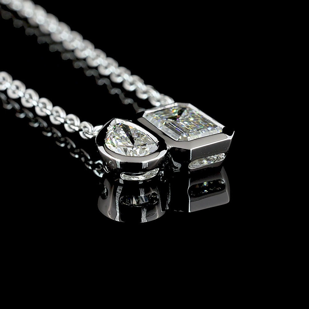 14K White Gold Toi et Moi Pendant with 1.10 Carat Emerald Cut and 0.48 Carat Pear Shape Lab Diamonds - 1.58 Carat Total Weight in Bezel Setting - Covaloro Fine Jewelry