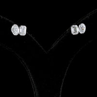 14K White Gold Toi et Moi Stud Earrings with Bezel Set Emerald Cut and Oval Cut Lab Diamonds - 2.05 Carat Total Diamond Weight - Covaloro Fine Jewelry