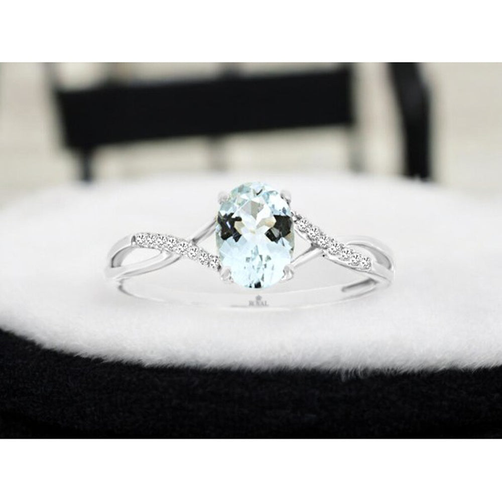 14K White Gold Twisted Band Ring with Oval Aquamarine and Pavé Set Diamond Accents - 0.68 Carat Aquamarine and 0.04 Carat Total Diamond Weight - Royal Jewelry