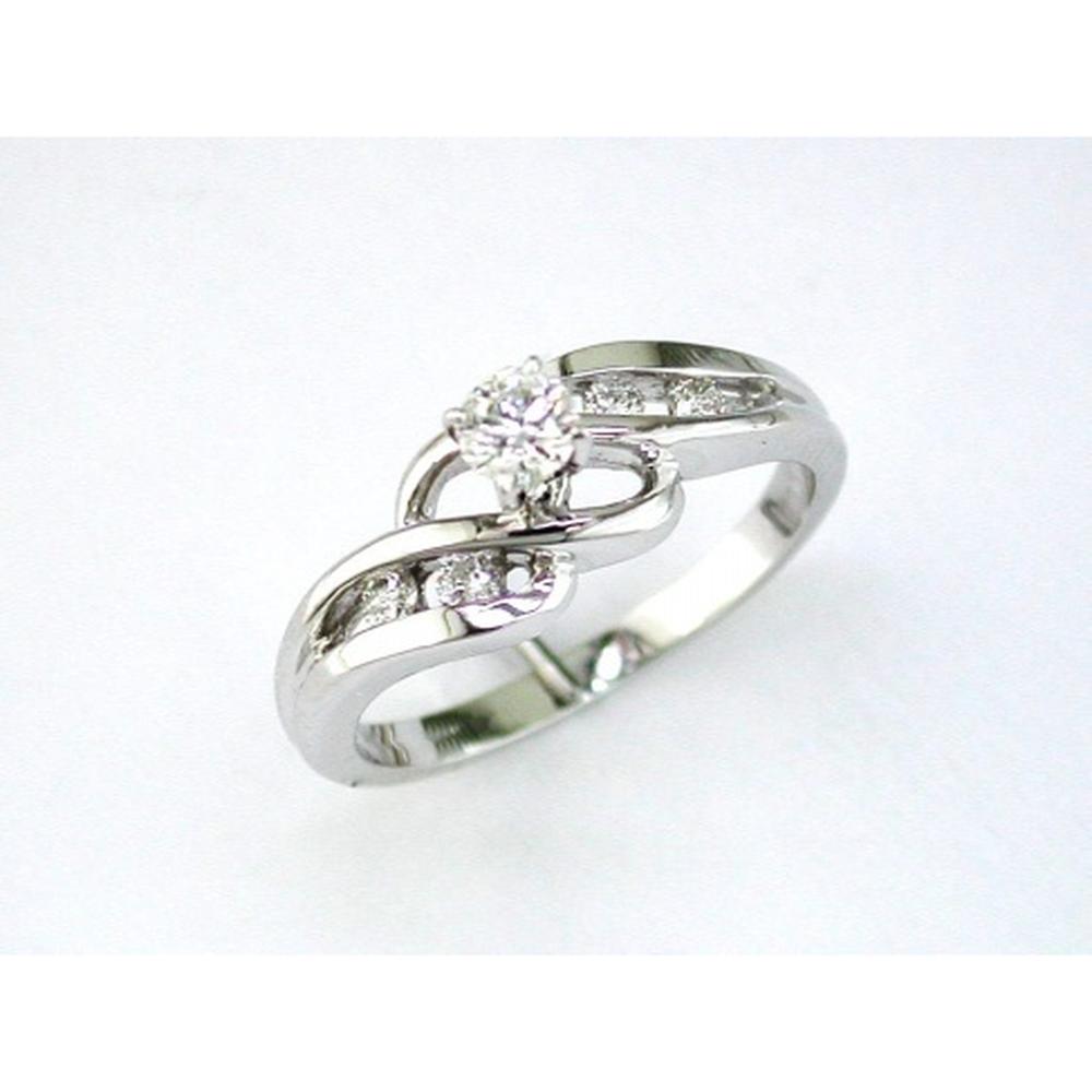 14K White Gold Twisted Engagement Ring with Round and Baguette Diamonds - 0.22 Carats Total Diamond Weight