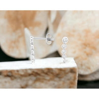 14K White Gold Vertical Diamond Stud Earrings with Bezel-Set Round Diamonds - 0.20 Carat Total Diamond Weight - Royal Jewelry