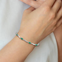 14K White Gold Wavy Link Bracelet with Oval Emeralds and Diamonds - 0.305 Carats Total Emerald Weight by Monteluci Fine Jewelry