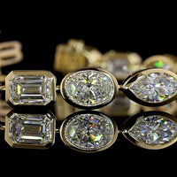 14K Yellow Gold 18-Stone Tennis Bracelet with Bezel Set Emerald, Oval, and Marquise Lab Diamonds - 15.44 Carat Total Weight - Covaloro Fine Jewelry