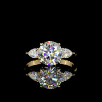 14K Yellow Gold 3-Stone Ring with 2.27 Carats Round Brilliant E VVS2 Lab Diamond and 0.44 Carats Pear Shape Side Stones - 2.71 Total Carat Weight - Covaloro Fine Jewelry