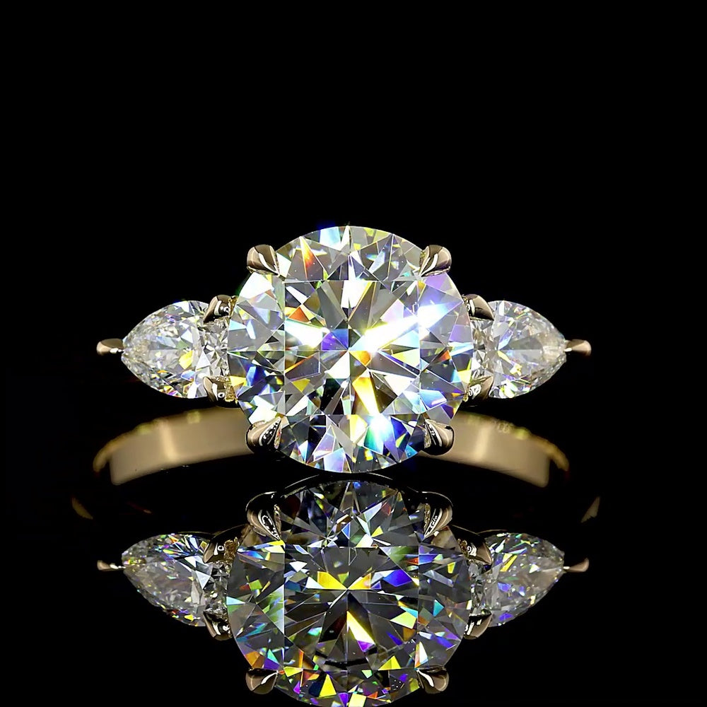 14K Yellow Gold 3-Stone Ring with 2.27 Carats Round Brilliant E VVS2 Lab Diamond and 0.44 Carats Pear Shape Side Stones - 2.71 Total Carat Weight - Covaloro Fine Jewelry