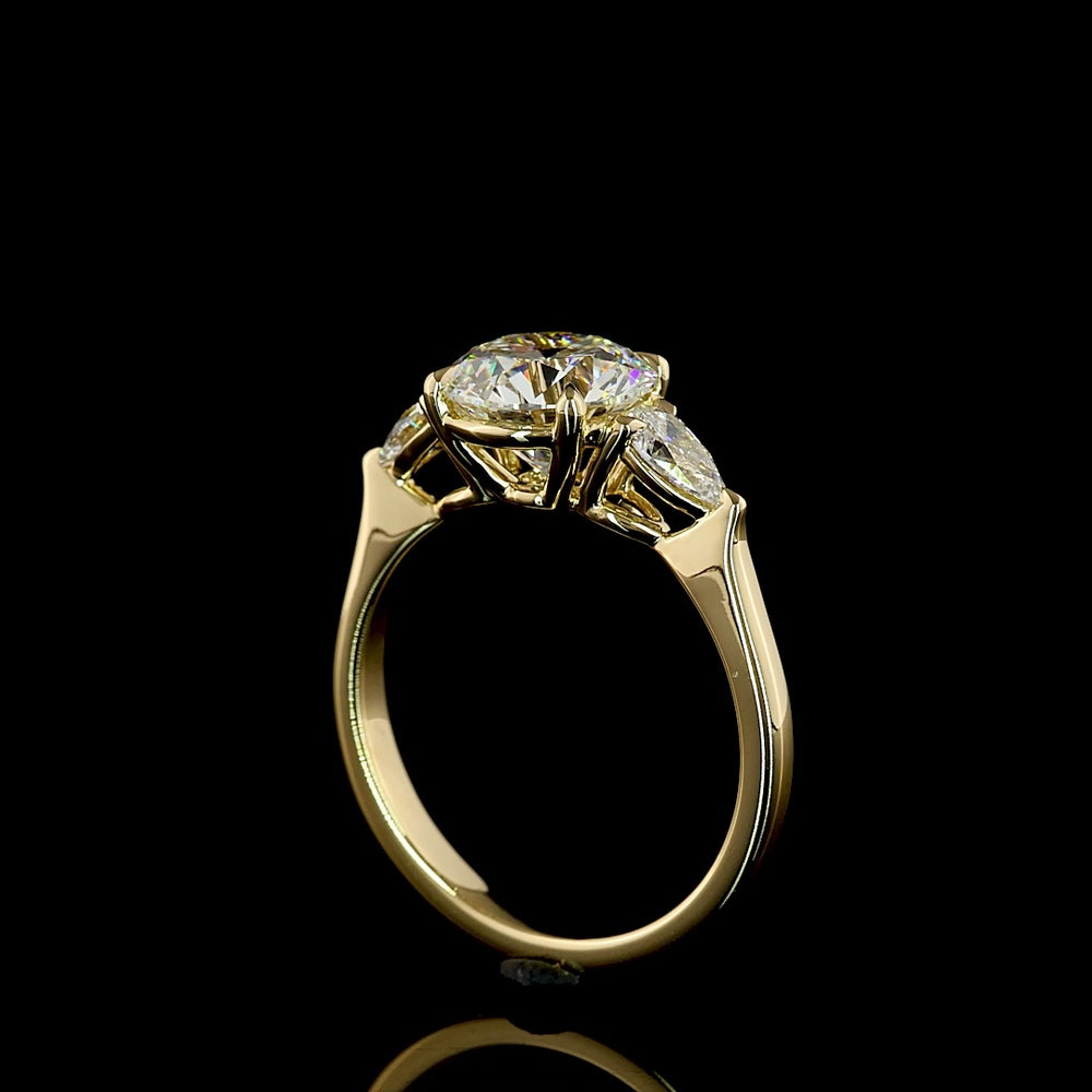 14K Yellow Gold 3-Stone Ring with 2.27 Carats Round Brilliant E VVS2 Lab Diamond and 0.44 Carats Pear Shape Side Stones - 2.71 Total Carat Weight - Covaloro Fine Jewelry