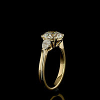 14K Yellow Gold 3-Stone Ring with 2.27 Carats Round Brilliant E VVS2 Lab Diamond and 0.44 Carats Pear Shape Side Stones - 2.71 Total Carat Weight - Covaloro Fine Jewelry