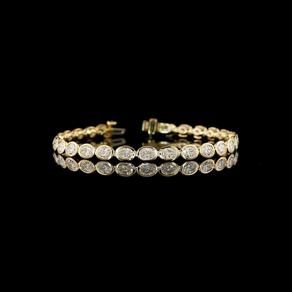 14K Yellow Gold 7.32 Carat Oval Cut Lab Diamond Tennis Bracelet with East-West Bezel Setting - 27 Stones, E-F VS1 Clarity - Covaloro Fine Jewelry