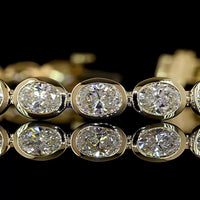 14K Yellow Gold 7.32 Carat Oval Cut Lab Diamond Tennis Bracelet with East-West Bezel Setting - 27 Stones, E-F VS1 Clarity - Covaloro Fine Jewelry