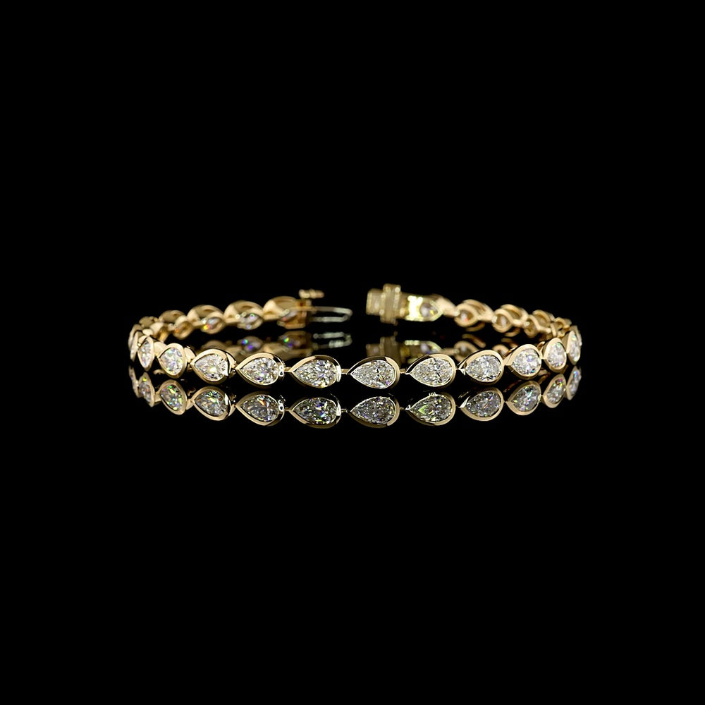 14K Yellow Gold 7.5" Tennis Bracelet with East-West Bezel Set Pear Shaped Lab Diamonds - 7.08 Carat Total Weight, E-F VS Clarity - Covaloro Fine Jewelry