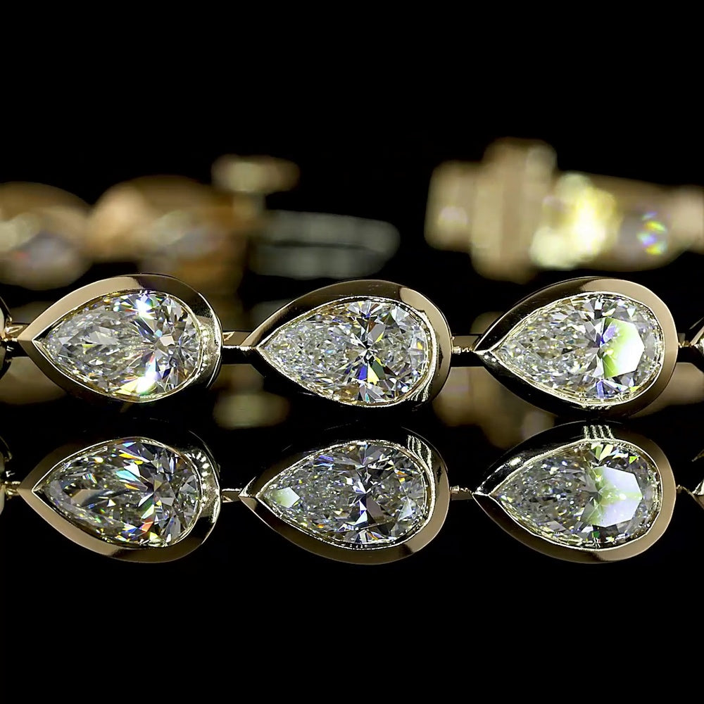 14K Yellow Gold 7.5" Tennis Bracelet with East-West Bezel Set Pear Shaped Lab Diamonds - 7.08 Carat Total Weight, E-F VS Clarity - Covaloro Fine Jewelry