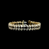 14K Yellow Gold 7.75" Mixed Shape Station Bracelet with Prong-Set Emerald, Oval, Heart, and Pear Cut Lab Diamonds - 7.54 Carat Total Weight - Covaloro Fine Jewelry