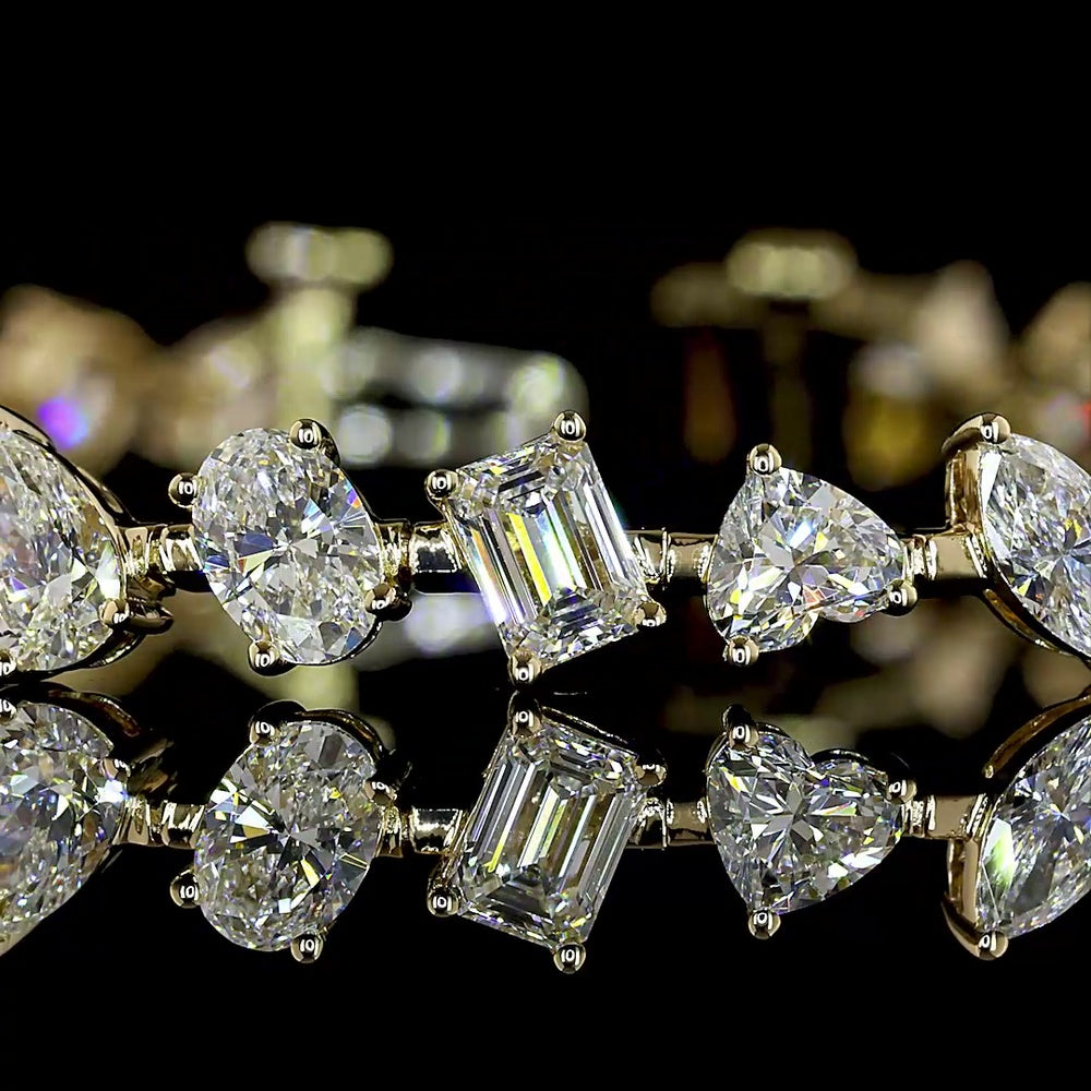 14K Yellow Gold 7.75" Mixed Shape Station Bracelet with Prong-Set Emerald, Oval, Heart, and Pear Cut Lab Diamonds - 7.54 Carat Total Weight - Covaloro Fine Jewelry