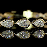 14K Yellow Gold 7.98 Carat Tennis Bracelet with East-West Bezel Set Pear Shaped Lab Diamonds - 24 Stones, E-F Color VS Clarity - Covaloro Fine Jewelry