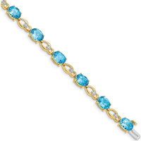 14K Yellow Gold 7" Fancy Link Bracelet with Oval Swiss Blue Topaz and Round Diamonds - 0.75 Carats Total Gemstone Weight by Monteluci Fine Jewelry