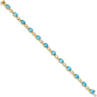 14K Yellow Gold 7" Fancy Link Bracelet with Oval Swiss Blue Topaz and Round Diamonds - 0.75 Carats Total Gemstone Weight by Monteluci Fine Jewelry