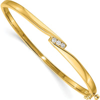 14K Yellow Gold 7-Inch Hinged Oval Bangle Bracelet with Three Channel-Set Round Diamonds - 1/8 Carat Total Weight by Monteluci Fine Jewelry