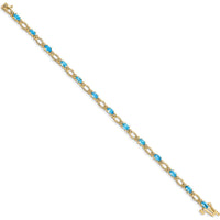 14K Yellow Gold 7" Tennis Bracelet with Oval Swiss Blue Topaz and Round Diamonds - 0.30 Carats Total Topaz Weight, 0.004 Carats Total Diamond Weight by Oro Pregiato