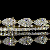 14K Yellow Gold Bangle Bracelet with East-West Set Pear Shape Lab Grown Diamonds and Diamond Bar Accent - 2.14 Carats Total Weight - Covaloro Fine Jewelry