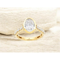 14K Yellow Gold Bezel-Set Oval Lab Grown Diamond Engagement Ring with Accented Band - 2.50 Carat Total Diamond Weight - Royal Jewelry