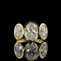14K Yellow Gold Bezel Set Three Stone Oval Cut Lab Diamond Ring Featuring a 2.01 Carat Center Stone with E-F VVS2 Clarity - 4.07 Carats Total Diamond Weight - Covaloro Fine Jewelry