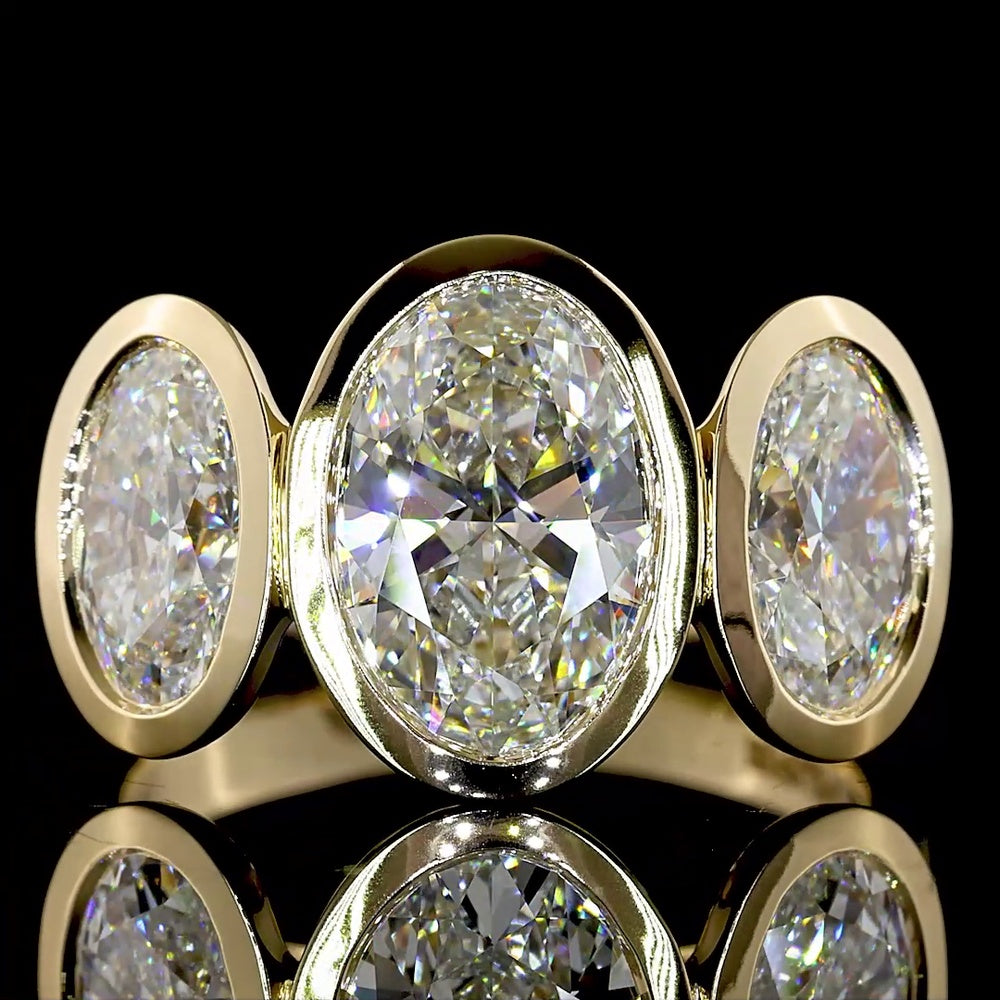 14K Yellow Gold Bezel Set Three Stone Oval Cut Lab Diamond Ring Featuring a 2.01 Carat Center Stone with E-F VVS2 Clarity - 4.07 Carats Total Diamond Weight - Covaloro Fine Jewelry