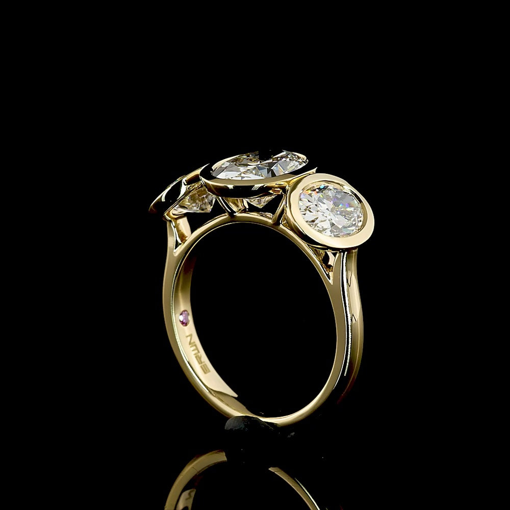 14K Yellow Gold Bezel Set Three Stone Oval Cut Lab Diamond Ring Featuring a 2.01 Carat Center Stone with E-F VVS2 Clarity - 4.07 Carats Total Diamond Weight - Covaloro Fine Jewelry