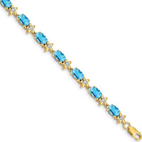 14K Yellow Gold Complete Diamond and Oval Swiss Blue Topaz Floral 7" Bracelet - 0.56 Carats Swiss Blue Topaz, 0.11 Carats Diamond Total Weight by Monteluci Fine Jewelry