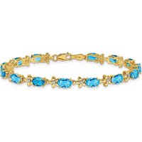14K Yellow Gold Complete Diamond and Oval Swiss Blue Topaz Floral 7" Bracelet - 0.56 Carats Swiss Blue Topaz, 0.11 Carats Diamond Total Weight by Monteluci Fine Jewelry