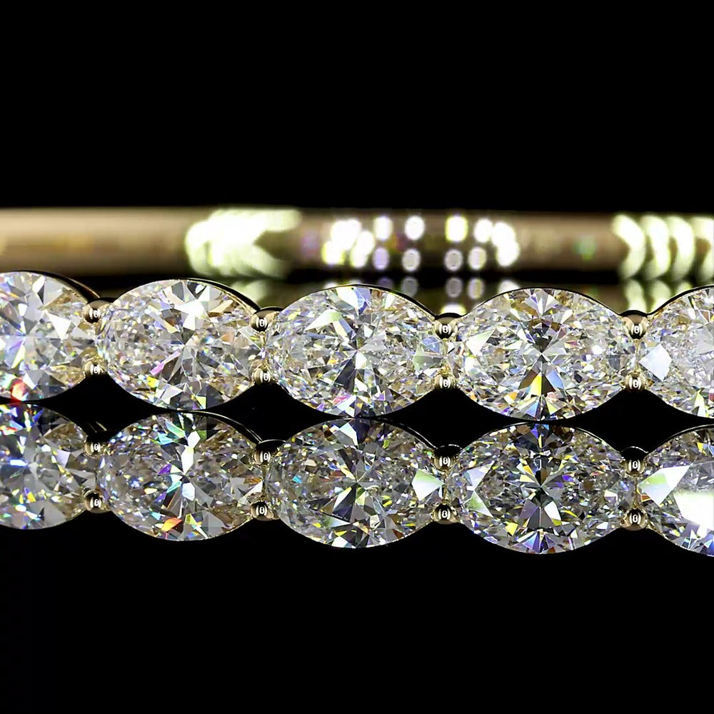 14K Yellow Gold East-West Bangle Bracelet with 13 Oval Cut Lab Diamonds - 5.64 Carats Total Diamond Weight - Covaloro Fine Jewelry
