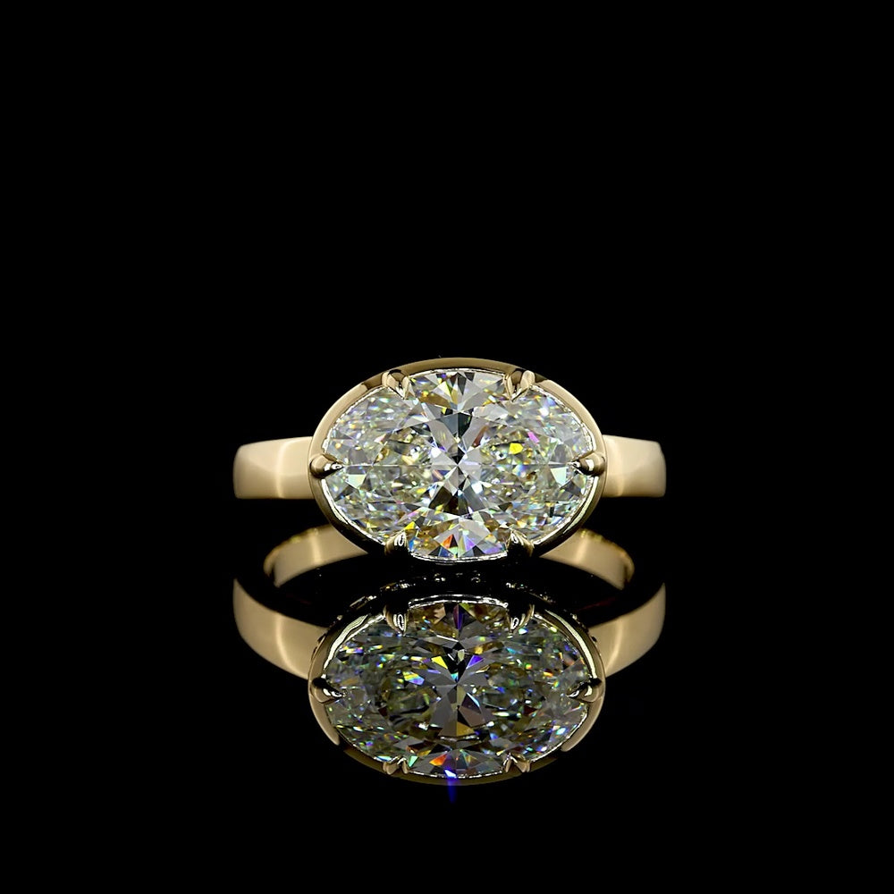 14K Yellow Gold East-West Hidden Halo Ring with 3.06 Carat Oval Lab Diamond and 0.25 Carat Round Lab Diamond Accents - 3.31 Carat Total Weight - Covaloro Fine Jewelry