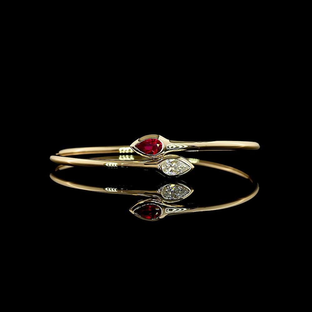 14K Yellow Gold East-West Pear Shape Bezel Set Bangle Bracelet with Lab-Grown Ruby - 0.59 Carat Total Weight - Covaloro Fine Jewelry