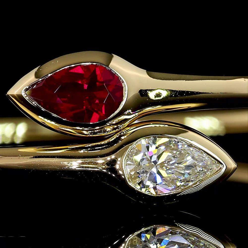 14K Yellow Gold East-West Pear Shape Bezel Set Bangle Bracelet with Lab-Grown Ruby - 0.59 Carat Total Weight - Covaloro Fine Jewelry
