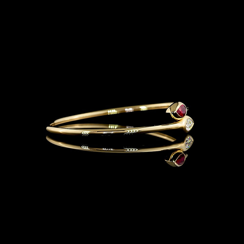 14K Yellow Gold East-West Pear Shape Bezel Set Bangle Bracelet with Lab-Grown Ruby - 0.59 Carat Total Weight - Covaloro Fine Jewelry