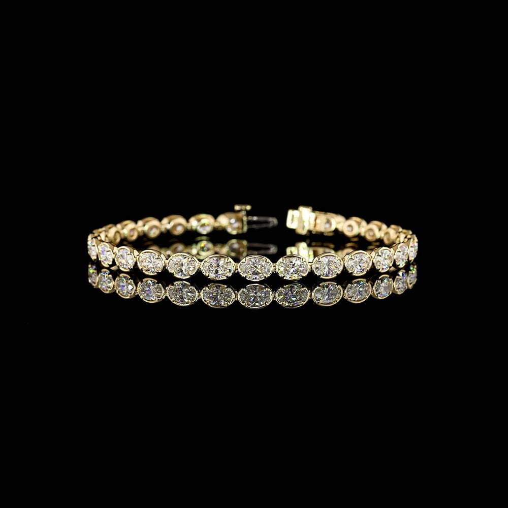 14K Yellow Gold East-West Tennis Bracelet with 28 Oval Cut Lab Diamonds - 7.65 Carats Total Diamond Weight, E-F Color VS1 Clarity, Bezel-Prong Setting - Covaloro Fine Jewelry