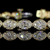 14K Yellow Gold East-West Tennis Bracelet with 28 Oval Cut Lab Diamonds - 7.65 Carats Total Diamond Weight, E-F Color VS1 Clarity, Bezel-Prong Setting - Covaloro Fine Jewelry