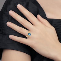 14K Yellow Gold Emerald Cut Blue Topaz Ring with Round Diamond Accents - 1.95 Carat Total Topaz Weight by Monteluci Fine Jewelry