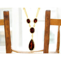 14K Yellow Gold Halo Drop Necklace with Oval and Pear-Shaped Garnets and Diamond Accents - 8.00 Carat Total Garnet Weight and 0.80 Carat Total Diamond Weight - Royal Jewelry