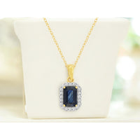 14K Yellow Gold Halo Pendant Necklace with Emerald Cut Sapphire and Round Diamonds - 0.70 Carat Sapphire and 0.09 Carat Total Diamond Weight - Royal Jewelry