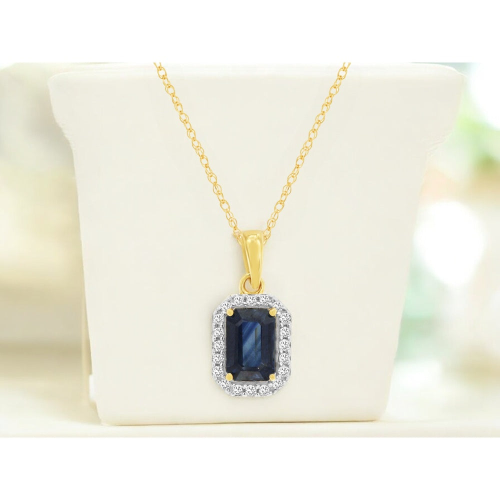 14K Yellow Gold Halo Pendant Necklace with Emerald Cut Sapphire and Round Diamonds - 0.70 Carat Sapphire and 0.09 Carat Total Diamond Weight - Royal Jewelry