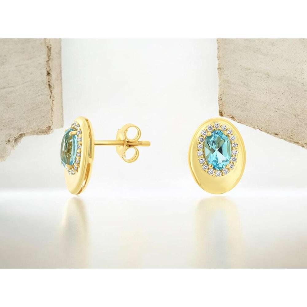 14K Yellow Gold Halo Stud Earrings with Oval Blue Topaz and Round Diamonds - 1.10 Carat Total Topaz Weight and 0.14 Carat Total Diamond Weight - Royal Jewelry
