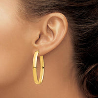 14K Yellow Gold High Polished 5mm Oval Hoop Earrings - Elegant and Timeless Design by 0
