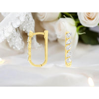 14K Yellow Gold Huggie Earrings with Pear-Inspired Diamond Accents - 0.25 Carat Total Diamond Weight - Royal Jewelry