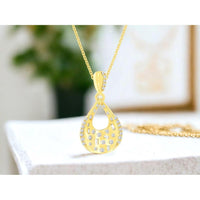 14K Yellow Gold Open Teardrop Pendant with Scattered Round and Baguette Cut Diamonds - 0.24 Carat Total Diamond Weight - Royal Jewelry